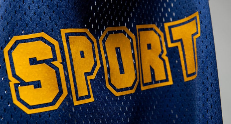 The word "Sport" in a sporty font on a mesh jersey made using ThermoSport