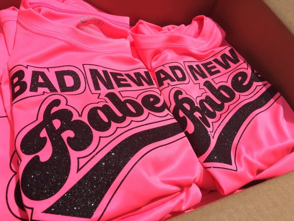 Shirts that read "Bad News Babes" pressed with Black GlitterFlex Ultra