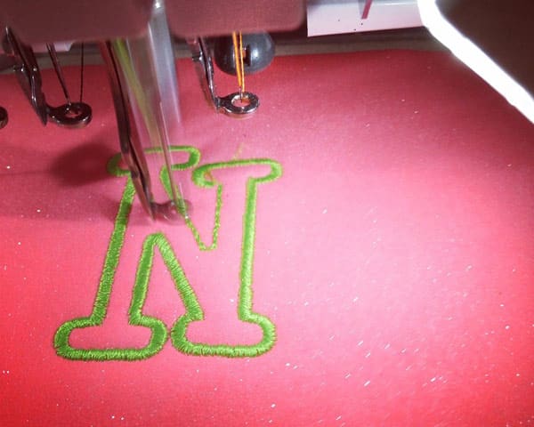 Embroidery Glitter on an embroidery machine being embroidered