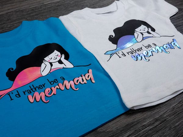 Two identical mermaid designs that read "I'd rather be a mermaid" created with Brilliant Rainbow DecoFilm layered on top of ThermoFlex Plus