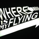 A design reading "Where is My Flying Skateboard" printed in Silver ReflectivePrintable with light being shined on it to show how reflective it is