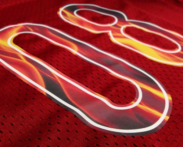 A close up of the numbers 08 cut into Subliblocker Printable- the image of fire was printed onto the material