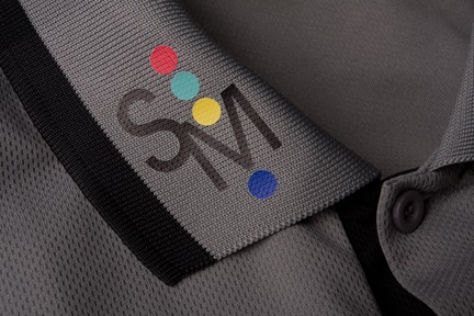 A shirt collar with the Specialty Materials logo printed in color on it printed in Ultimate Print Soft Matte PoliPrintables
