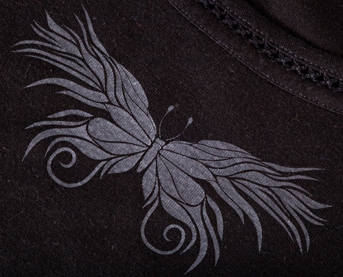 A butterfly on a black shirt made with ThermoFlex Plus Frosty Clear