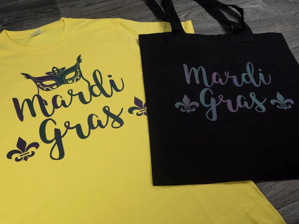 A shirt and bag that read "Mardi Gras"- the shirt has a mask on it as well made in Chameleon Reflective Black Reflection Decoration