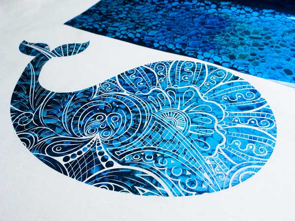 A whale outline with a highly decorative inside made with Blue Pebbles Textile Foils