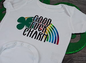 Image depicting the downloadable cut file that says "Good Luck Charm" with a rainbow in the background and a four leaf clover