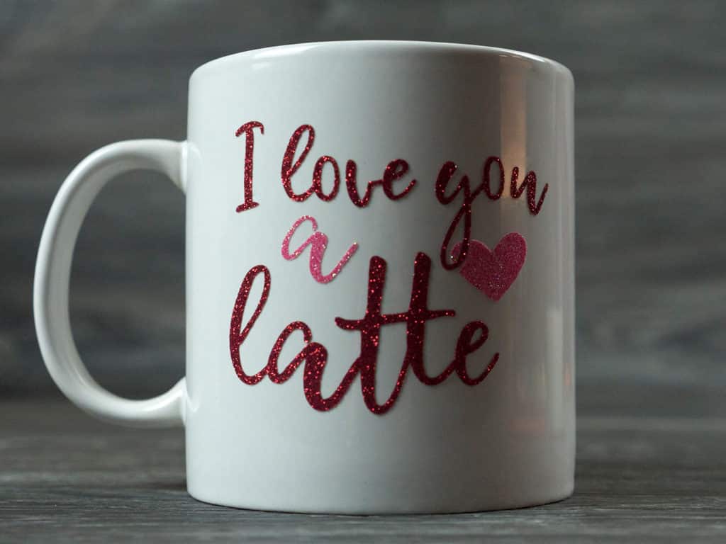 The finished mug reading "I love you a latte" made in Red and Rainbow Red Pressure Sensitive GlitterFlex Ultra
