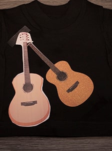 The finished sublimated image on the GlitterFlex Ultra with the cut guitar image on sublimation paper