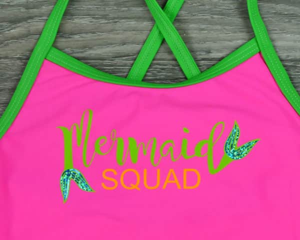 A swimsuit with the words "Mermaid Squad" made with ThermoFlex Turbo and DecoSparkle