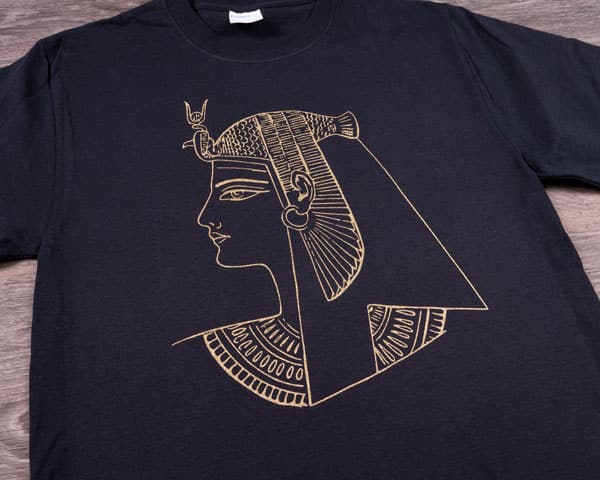 A design that looks like an ancient Egyptian piece in Gold GlitterFlex Light