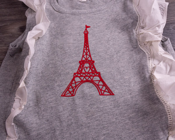 An Eiffel Tower on a frilly shirt made with Red Dimension 2