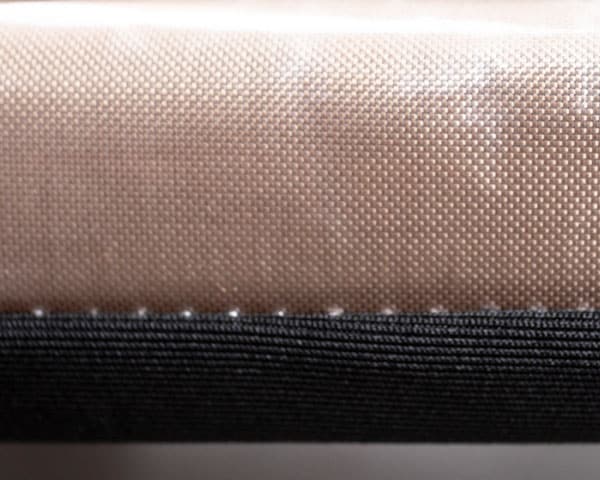 A close up of a teflon platen wrap on a heat press