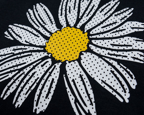 A flower made with White and Yellow Perf FashionFlex
