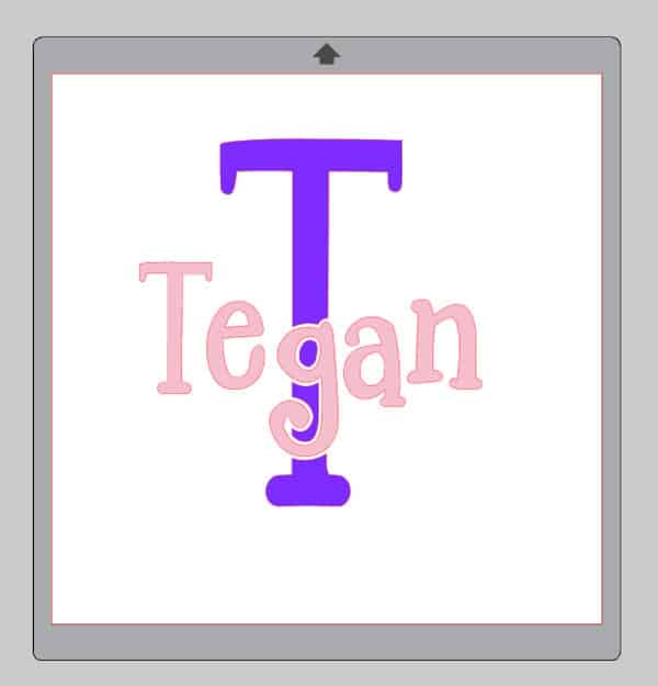 The finished monogram reading "Tegan" with a large T behind it