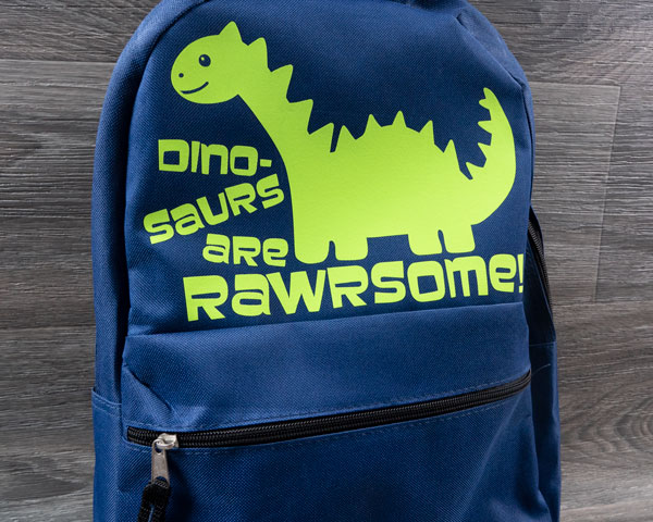 A finished backpack using the Dinosaurs are Rawrsome design