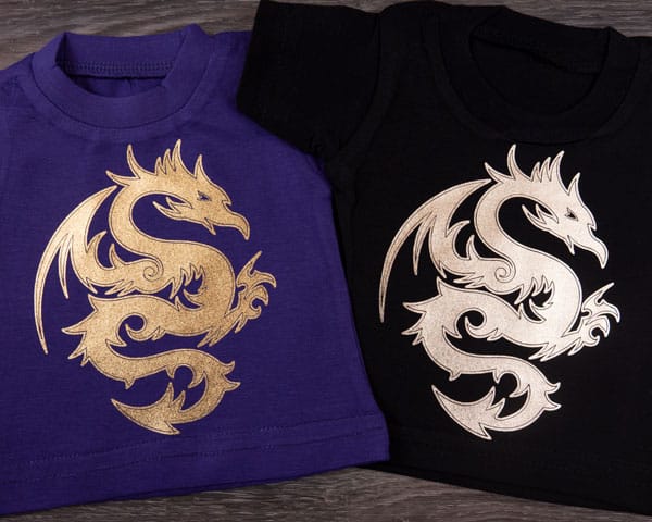 Two t-shirts decorated with the same dragon in Gold and Light Gold DecoFilm Soft Metallics