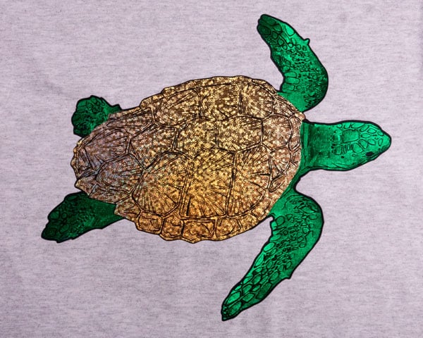 A turtle made using ThermoFlex Plus and Green and Bubble Gold DecoFilm Soft Metallics