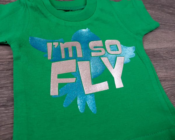 A bird design with the words "I'm so fly" in Blue and Silver PearlFlex