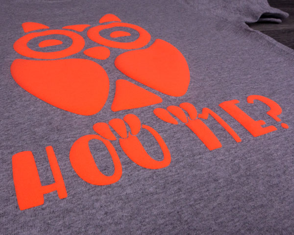 An owl on top of the words Hoo Me? pressed in Neon Orange FashionFlex® Puff