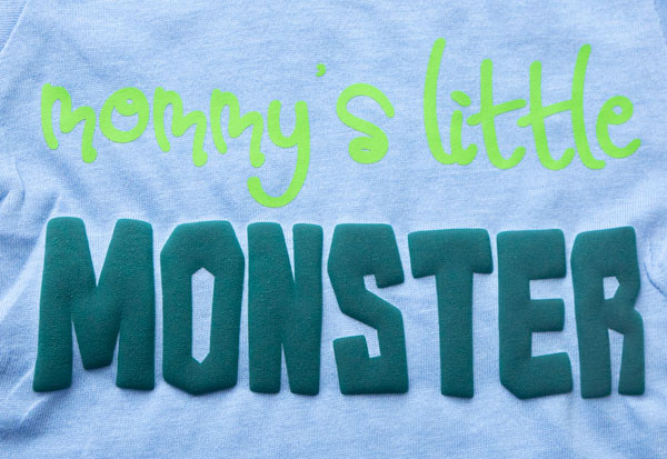 A shirt with the text "Mommy's Little Monster" done in ThermoFlex Plus and Bright Green FashionFlex Puff on the word "monster"