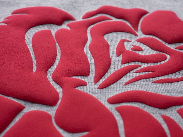 A close up of Red FashionFlex Puff cut into the design of a rose