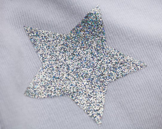 A close shot of Silver GlitterFlex II cut into a star