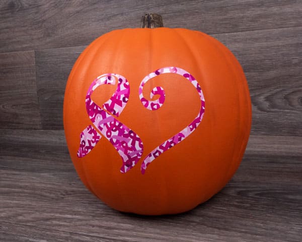 An orange pumpkin with a cancer awareness ribbon that turns into a heart made from Awareness 3 SpecialtyPSV Fashion Patterns
