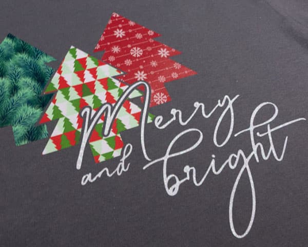 A shirt with Christmas tress cut in ThermoFlex Fashion Patterns and GlitterFlex Ultra