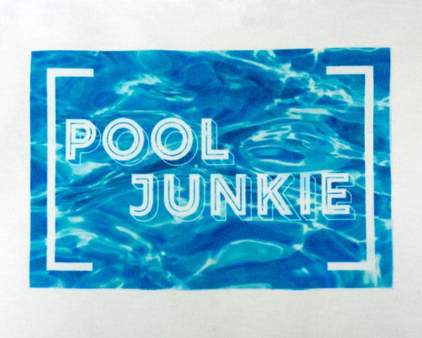The words "pool junkie" on a pool water background sublimated onto SubliFlex®