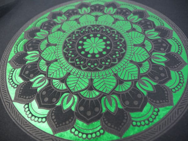 A mandala made with Frosty Clear and Green DecoFilm Soft Metallics layered on top. This close up shows the detail on the design.