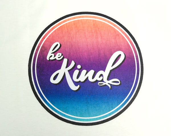 The Be Kind sublimation file pressed on SubliFlex and pressed on a shirt