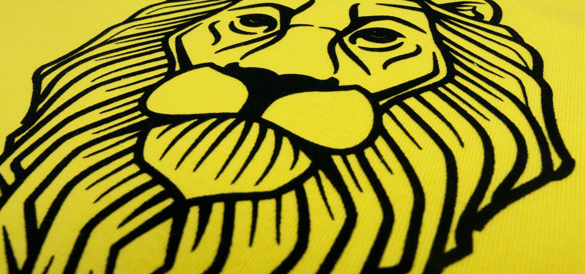 A design of a lion with a crown made with Black Premium DecoFlock®. There are two pictures- one shows the design and the second is a close up to show the flock texture.