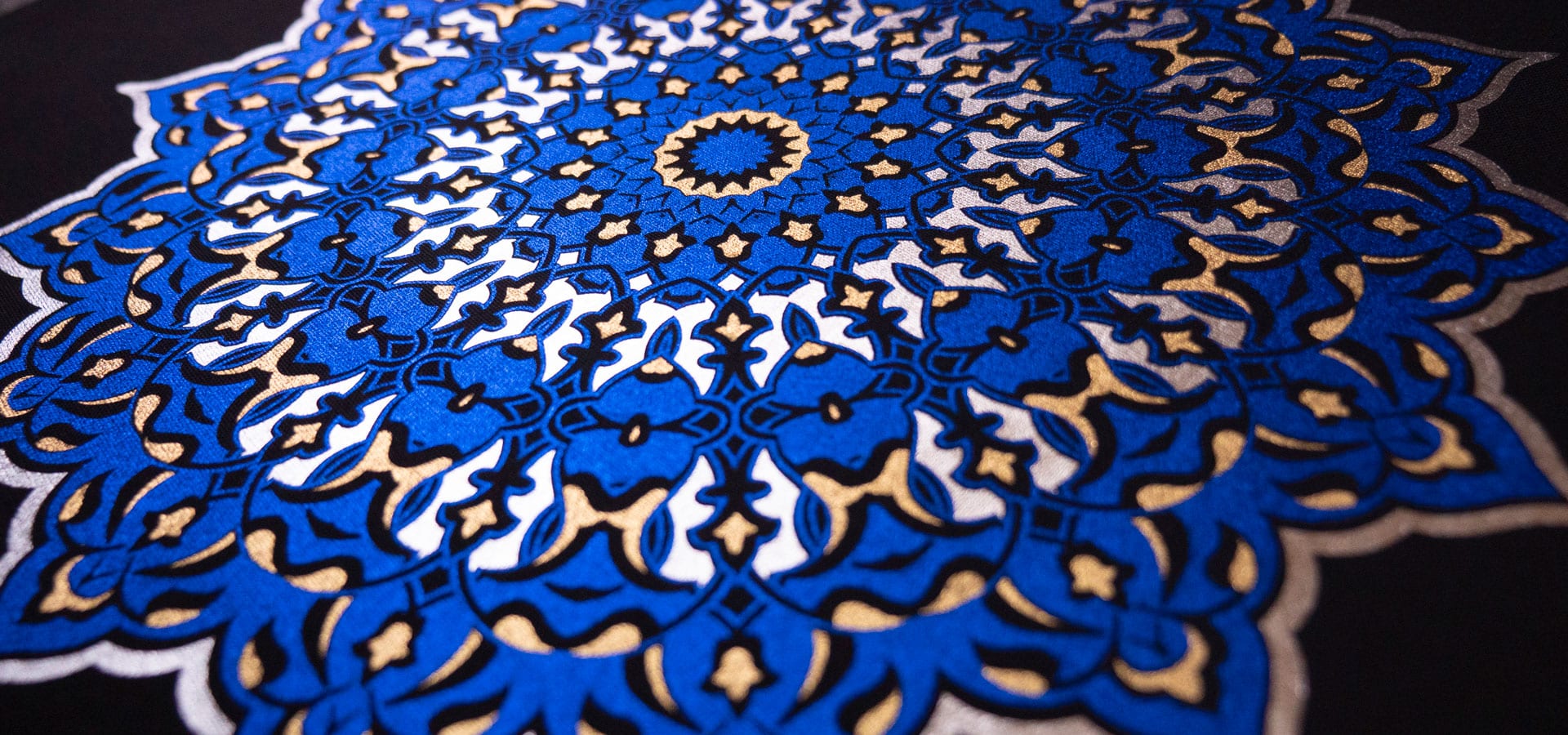 A mandala made with three colors- Silver, Light Gold, and Blue DecoFilm Soft Metallics