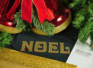 Image depicting the downloadable cut file that says "Noel" outlined in GlitterFlex Ultra