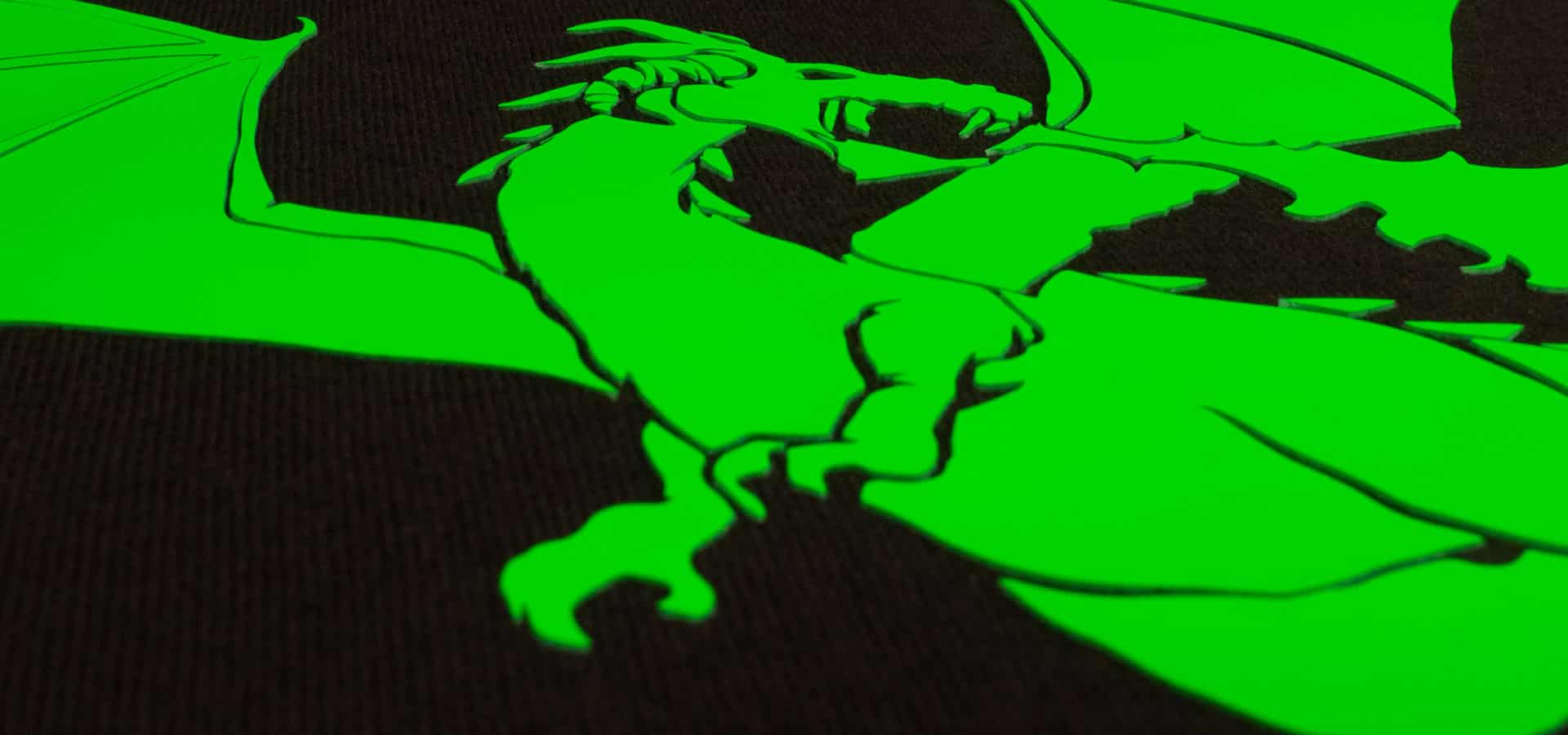 A dragon design made with Neon Green Dimension 2- the image is taken at an angle to show the thickness of the material.