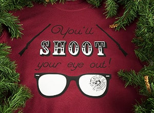 Image depicting the downloadable cut file that says "You'll Shoot Your Eye Out" with rifle decorations and broken glasses